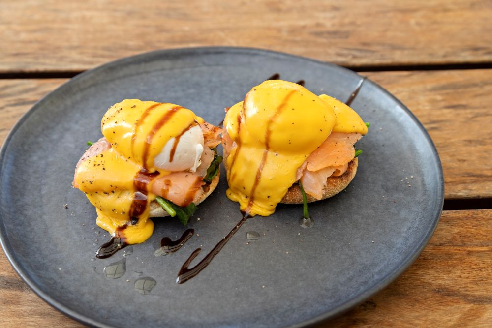 Smoked salmon Eggs Benedict served with poached eggs and creamy hollandaise sauce at Taipa Beach Resort Restaurant in Doubtless Bay, Northland.